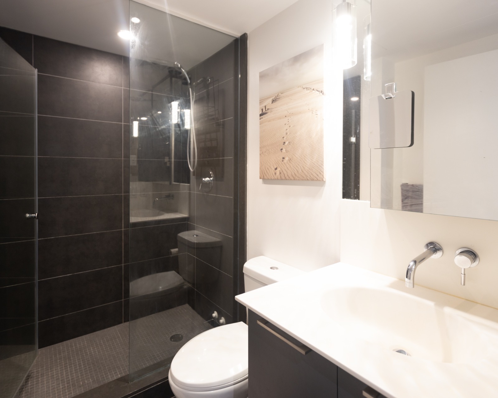 Bathroom with shower and vanity
